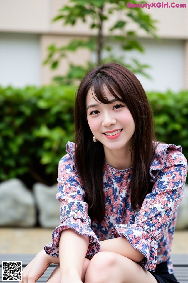 A woman sitting on a wooden bench smiling at the camera.