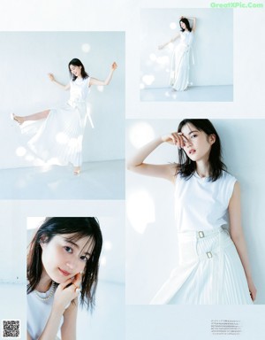 A woman in a white dress is posing for a magazine.