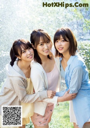 A group of young women sitting on top of a magazine cover.