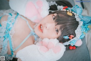 A woman in a bunny costume posing for a picture.