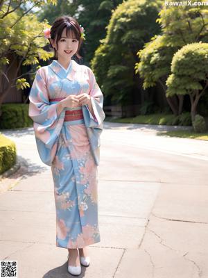 A woman in a yellow kimono sitting on a wooden bench.