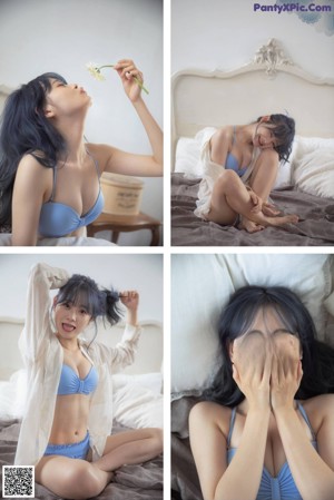 a woman in a blue bikini laying on a bed