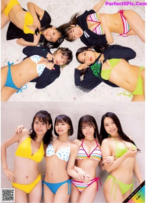 A group of young women in bikinis posing for a picture.